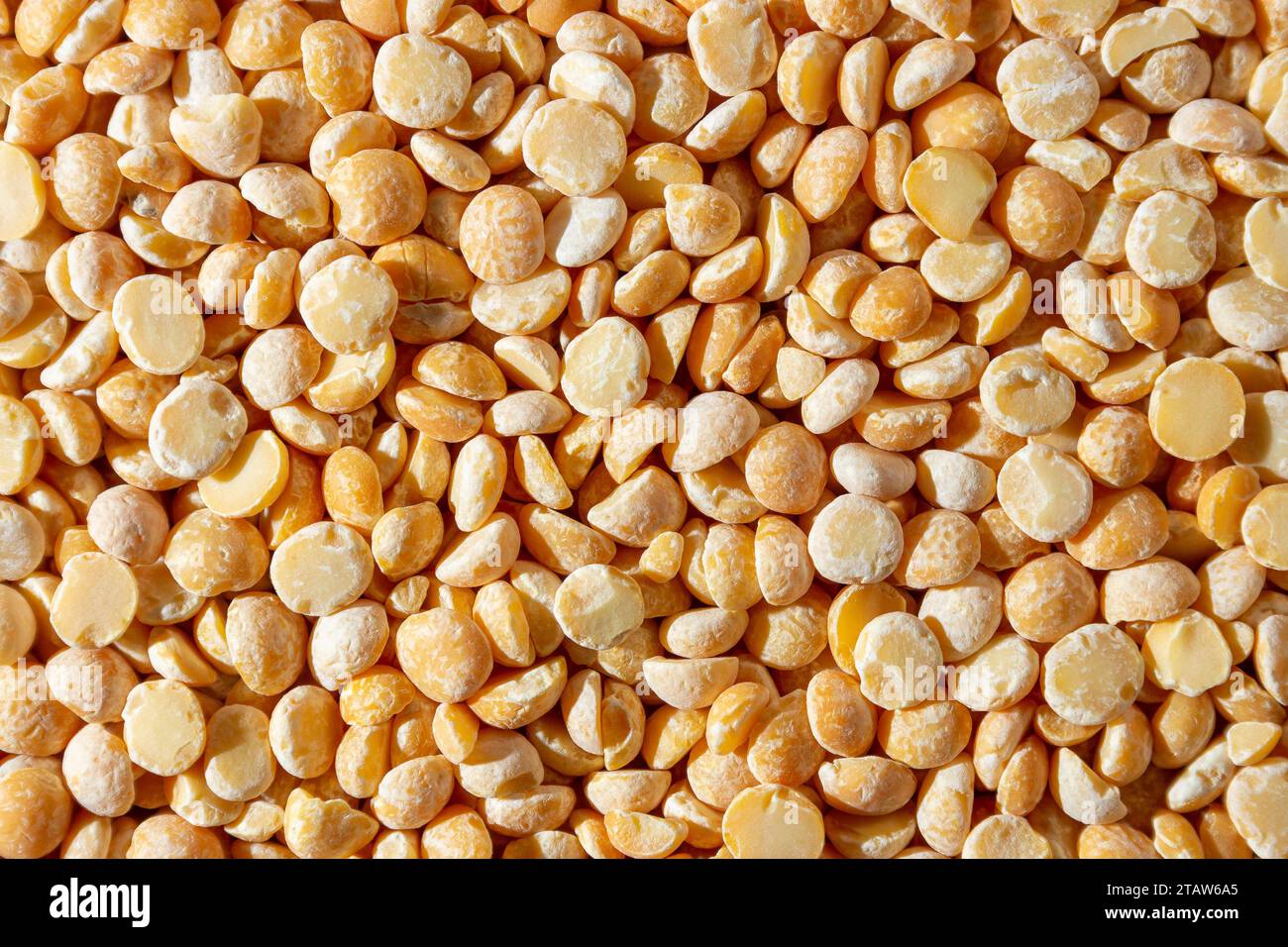 Uncooked Polished Split Peas Background. A Culinary Canvas of Dry