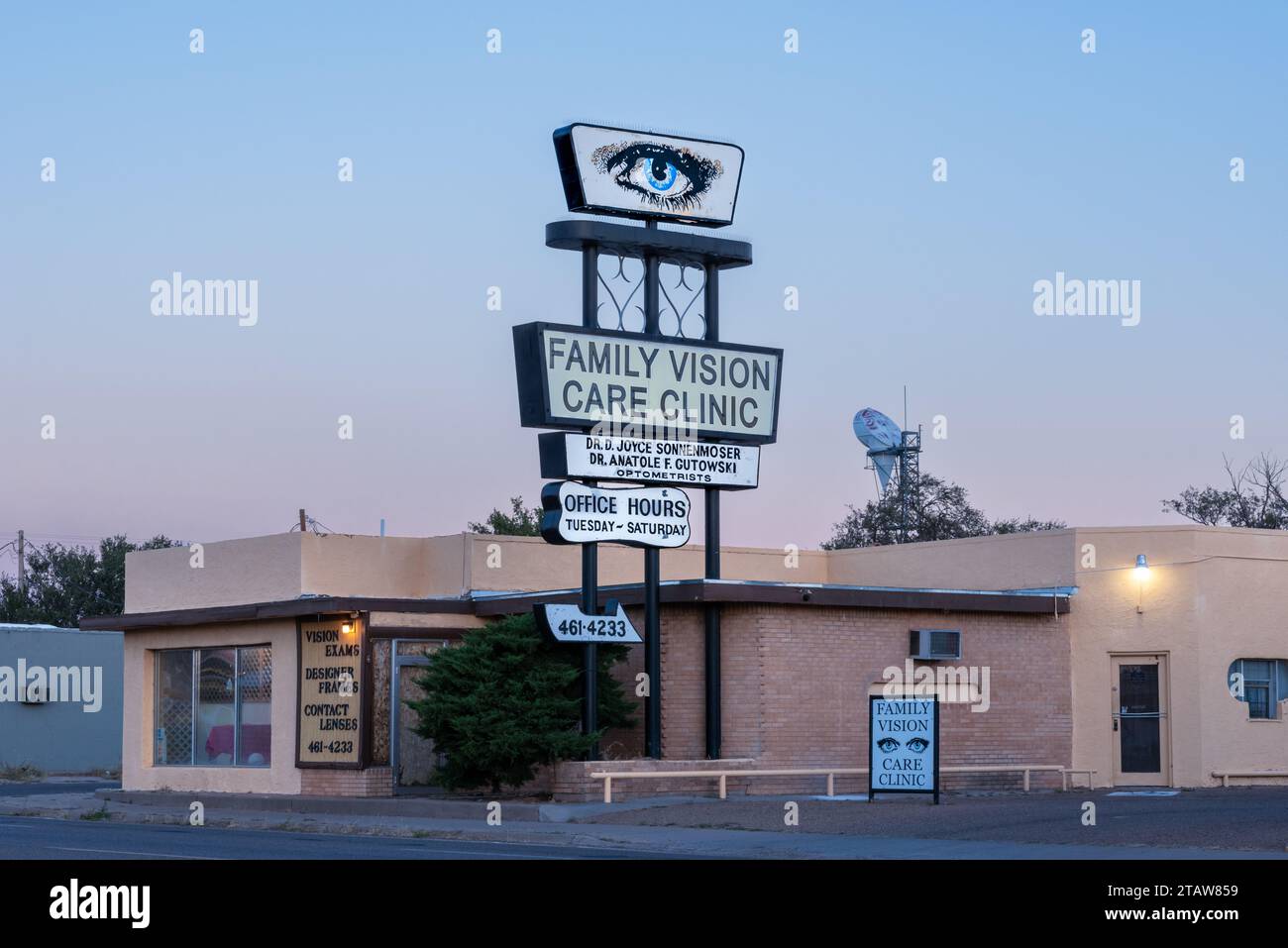 A onestory office building for optometrists with tall pole sign that