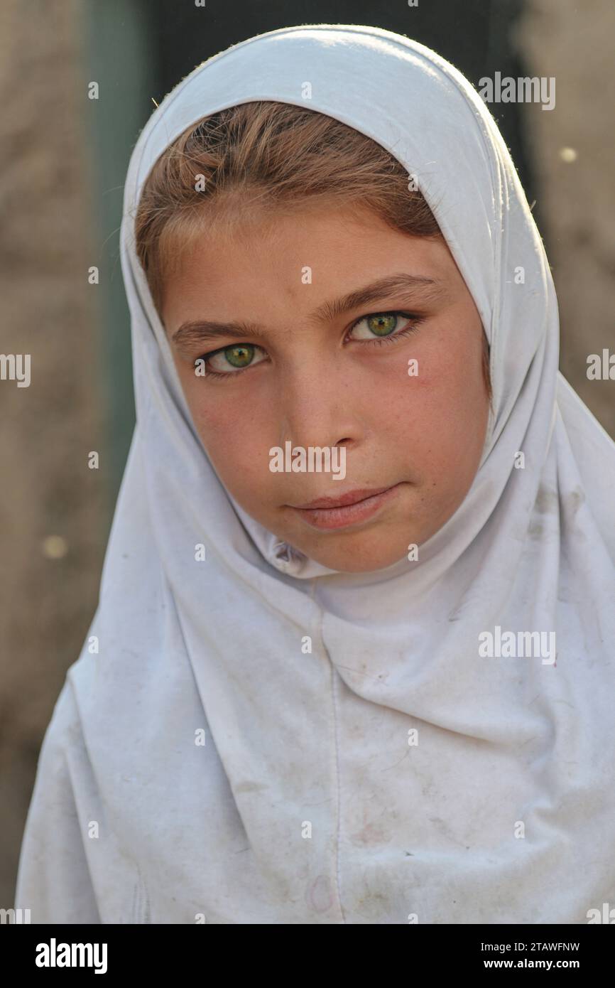 Education in Afghanistan: Schools in impoverished countries, schoolboys in a classroom in an Afghan school. Stock Photo