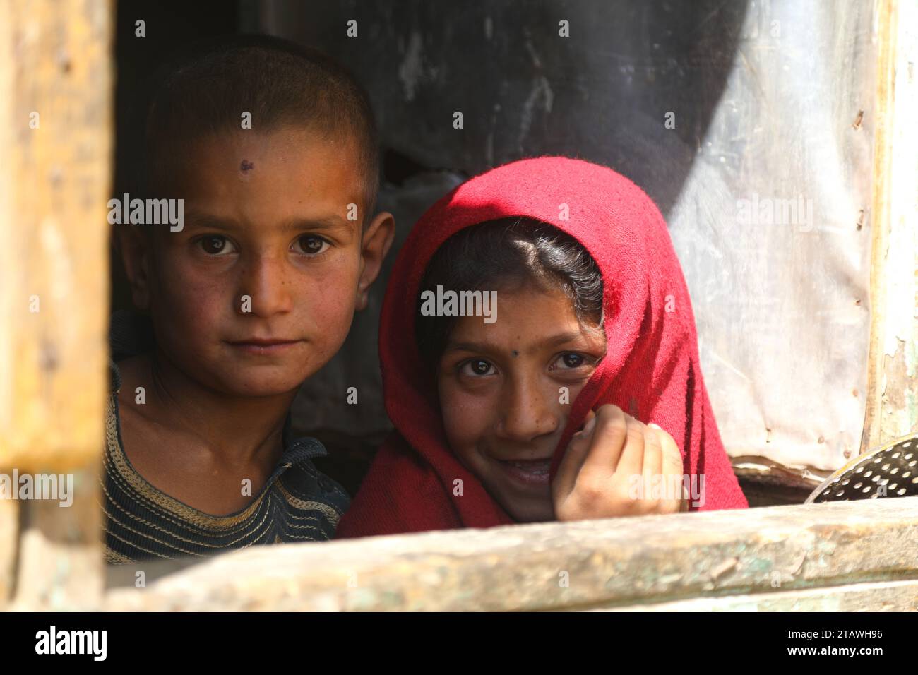 Happy Afghan poor children, happy young girl, happy young boy, Needy children Stock Photo