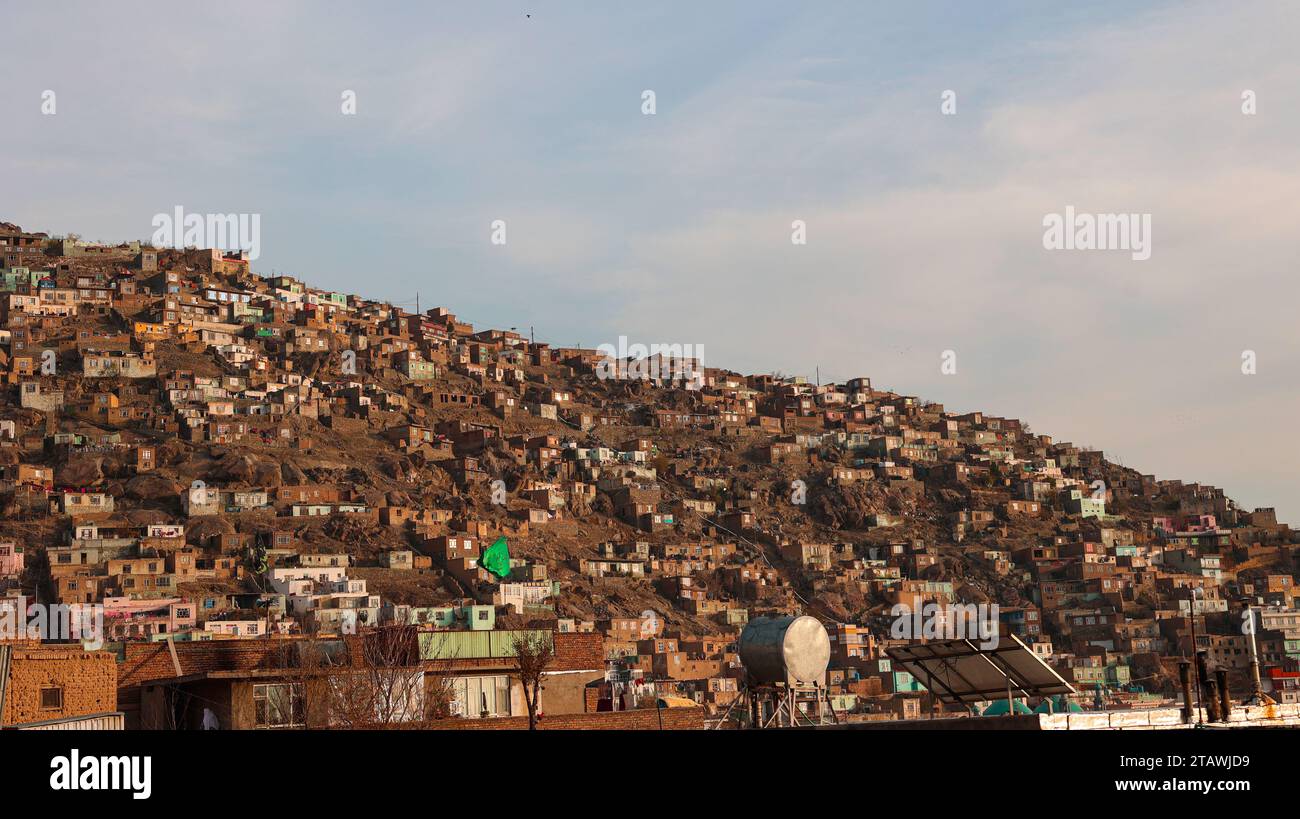 Aerial view of Kabul city, with Kabul city buildings and a building on top of a hill. Stock Photo