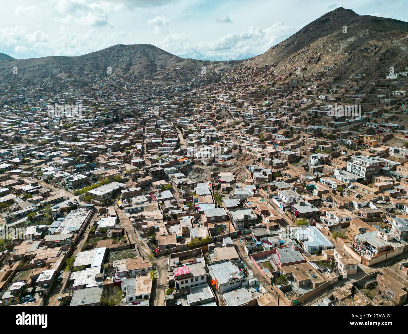 Aerial view of Kabul city, with Kabul city buildings and a building on top of a hill. Stock Photo