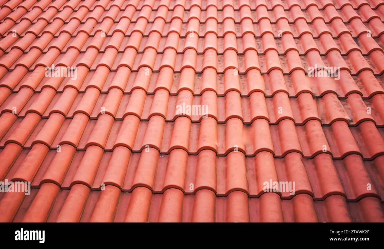 Spanish Tiles for roof. Red roof tiles on house as background image