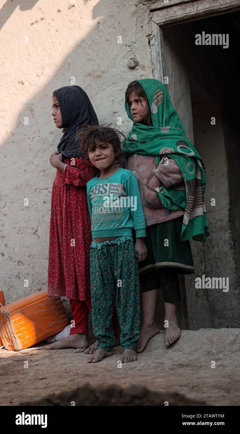 Needy refugee children in a dire situation seeking assistance | Refugee children in need, looking for help in a difficult situation. Stock Photo