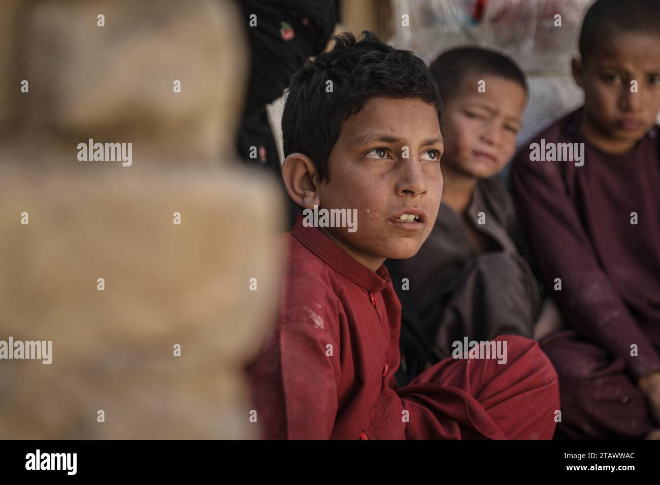 Needy refugee children in a dire situation seeking assistance | Refugee children in need, looking for help in a difficult situation. Stock Photo