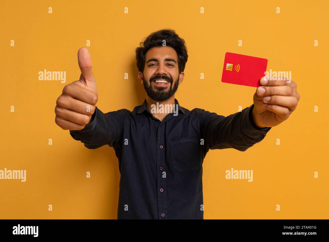Indian Man Holding Credit Card In His Hand And Showing Thumb Up Stock ...