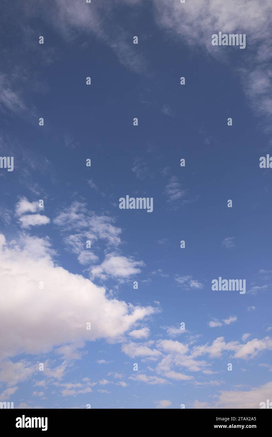 Blue sky with clouds | A sky with blue hues adorned by fluffy white clouds. Stock Photo
