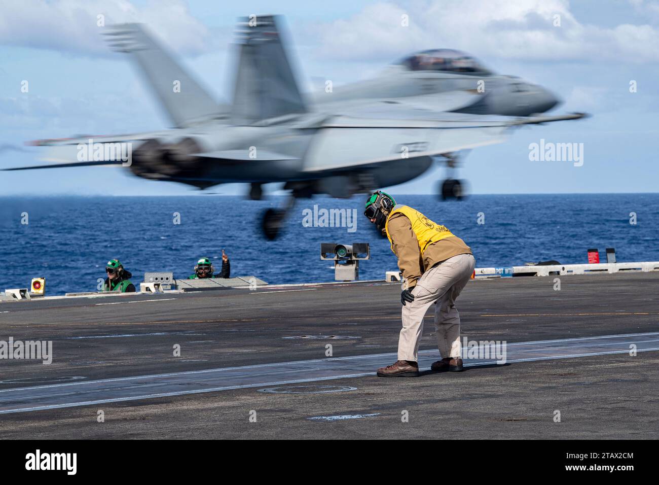 U.S. Navy Lt. Andrew Bentley stands watch as a “shooter” on the flight ...