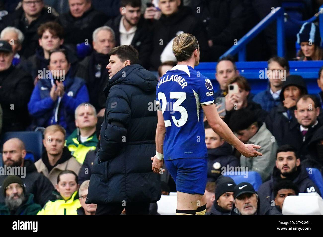 Chelsea's Conor Gallagher leaves the pitch past manager Mauricio Pochettino after being shown a red card during the Premier League match at Stamford Bridge, London. Picture date: Sunday December 3, 2023. Stock Photo