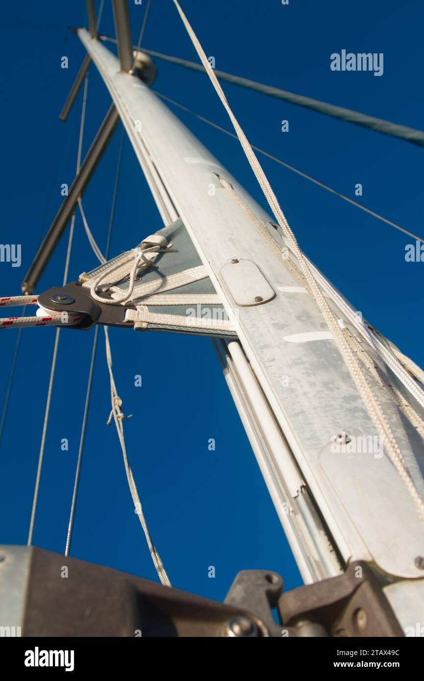 View Looking Up A Sailing Boat Yacht Mast With In Mast Furling And The Sail Stored, Furled Into The Mast, UK Stock Photo