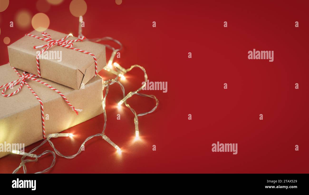 Christmas gift boxes wrapped in craft paper with striped red and white ...