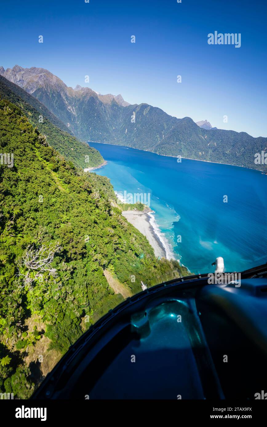 Helicopter flight from Martins Bay to Milford Sound, Fiordland national park, South Island, New Zealand. Stock Photo