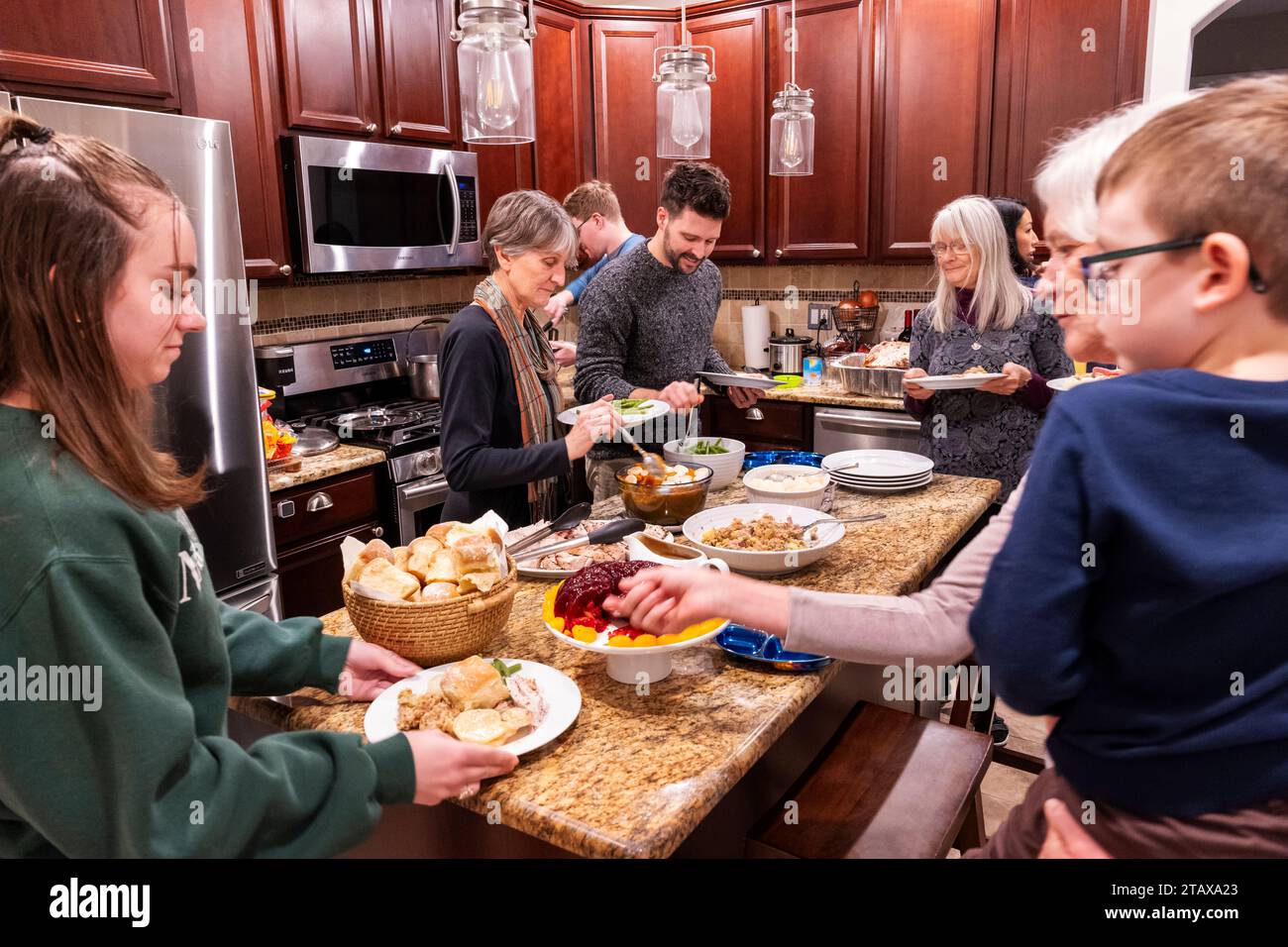 Family members gathering at traditional Thanksgiving Day meal Stock Photo