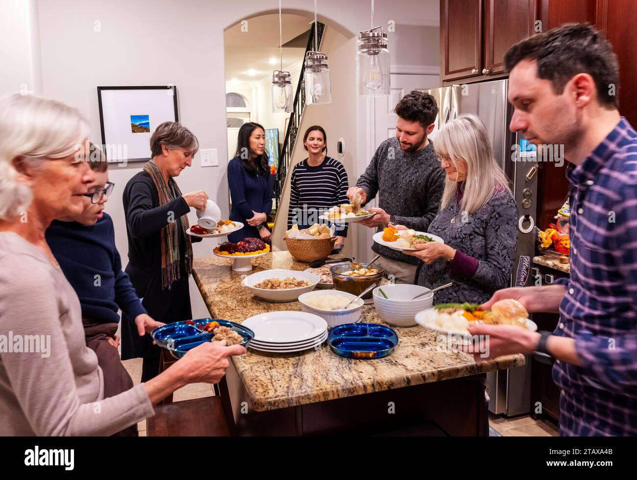 Family members gathering at traditional Thanksgiving Day meal Stock Photo