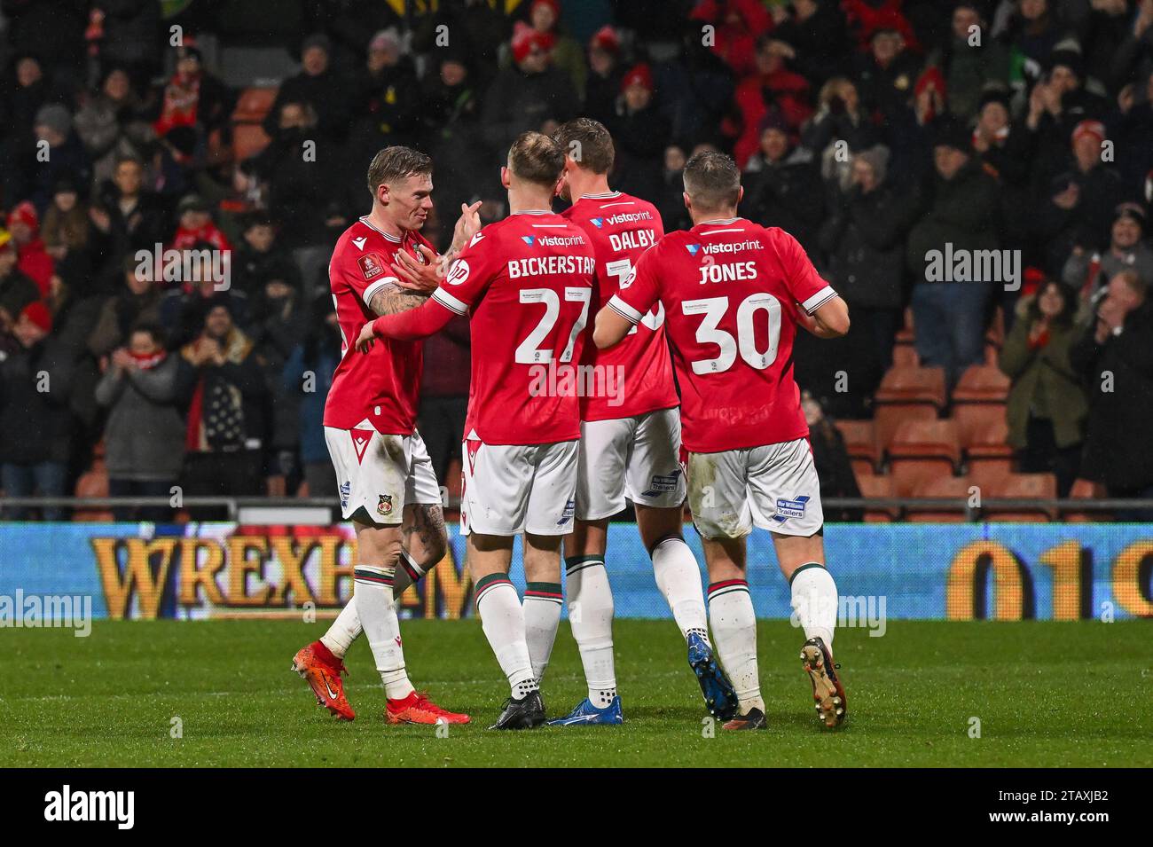 Sam Dalby 18 of Wrexham celebrates his goal to make it 30 during the
