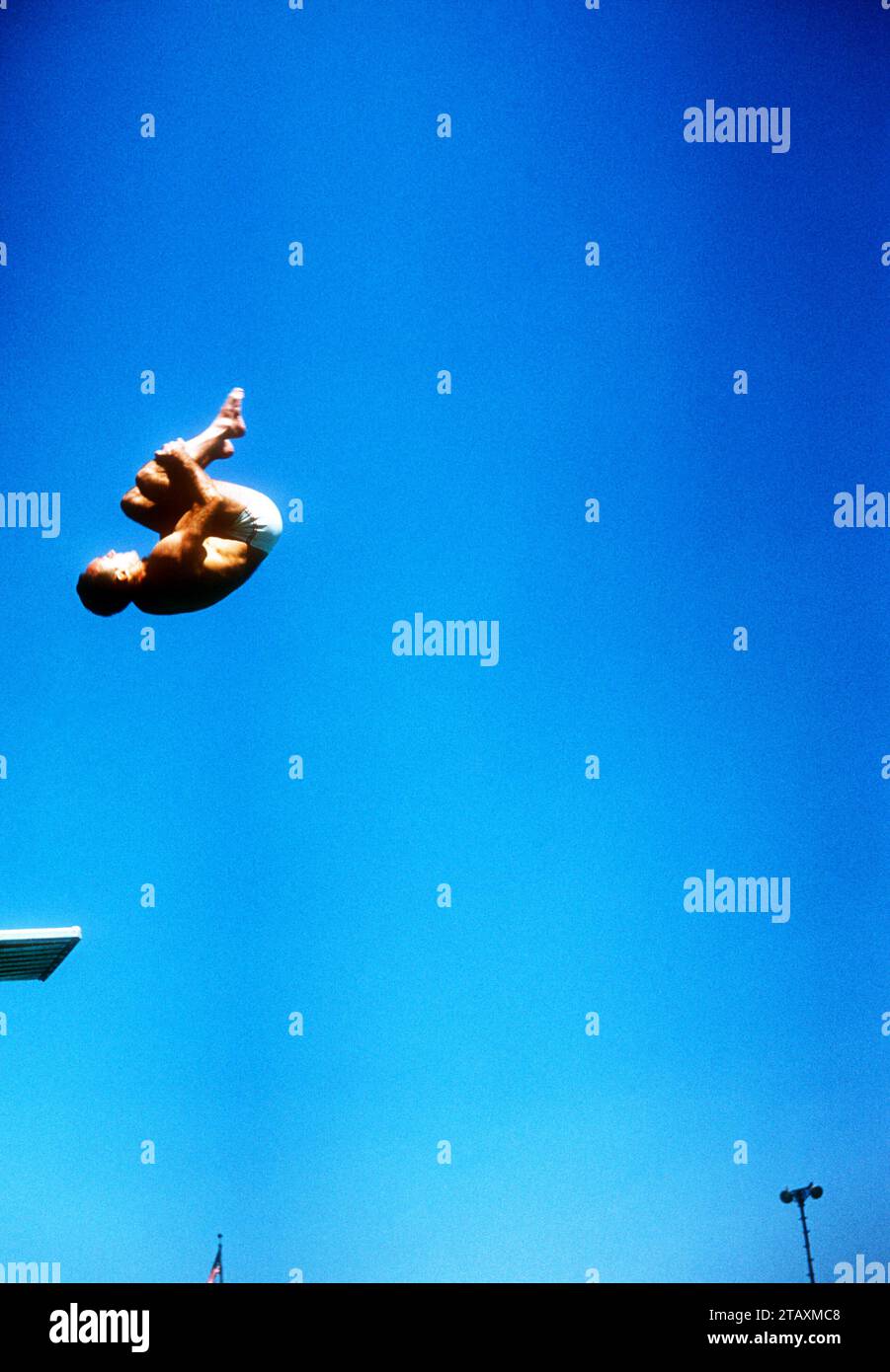 LOS ANGELES, CA - JULY 20: Joaquin Capilla (1928-2010) of Mexico makes his dive during the Senior Men's National A.A.U. Diving Championships on July 20, 1955 in Los Angeles, California.  (Photo by Hy Peskin) *** Local Caption *** Joaquin Capilla Stock Photo