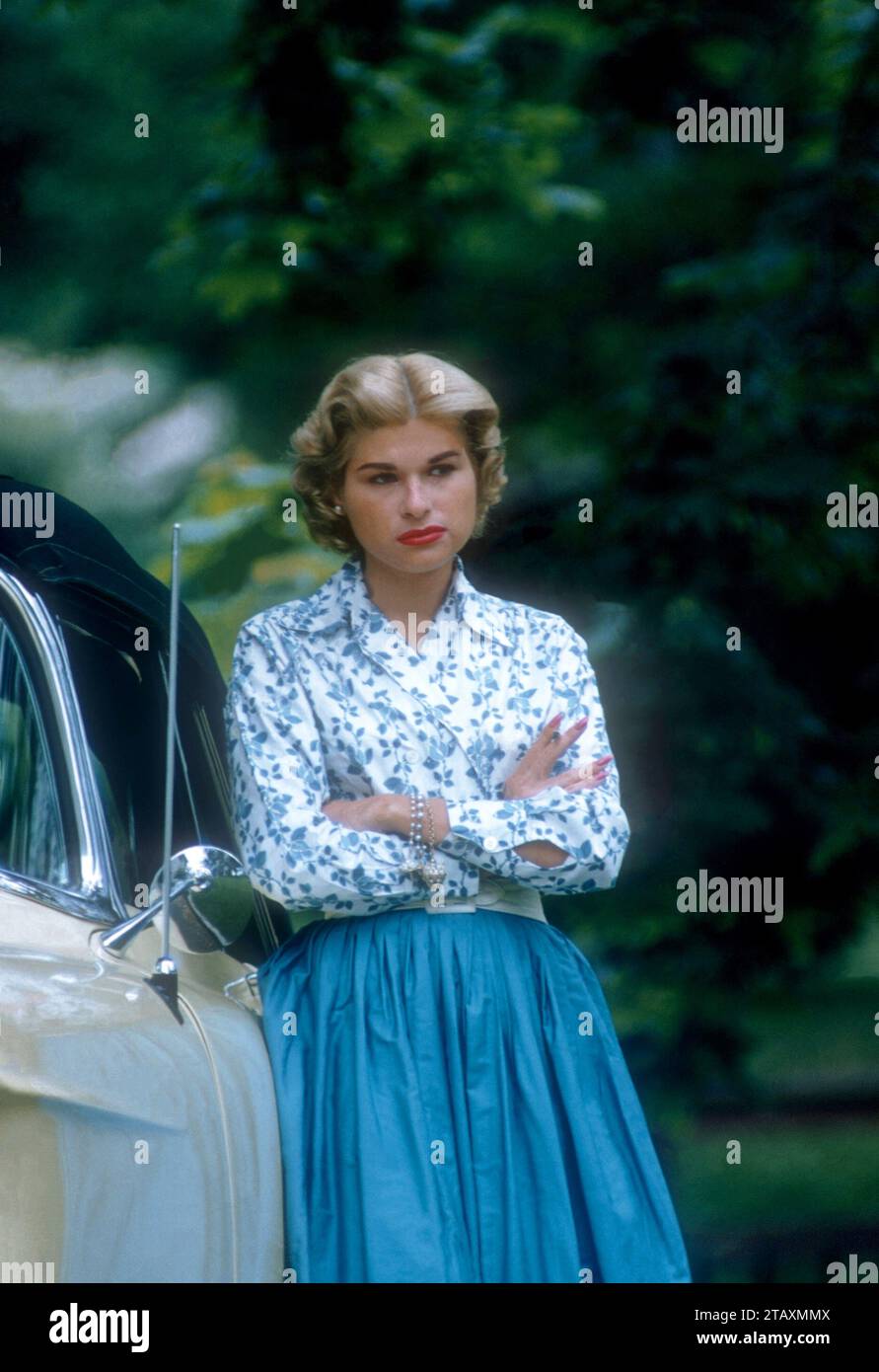 1955 General View Of A Woman Posing For A Portrait Next To Her Car 1955 General View Of A Woman Posing For A Portrait Next To Her Car