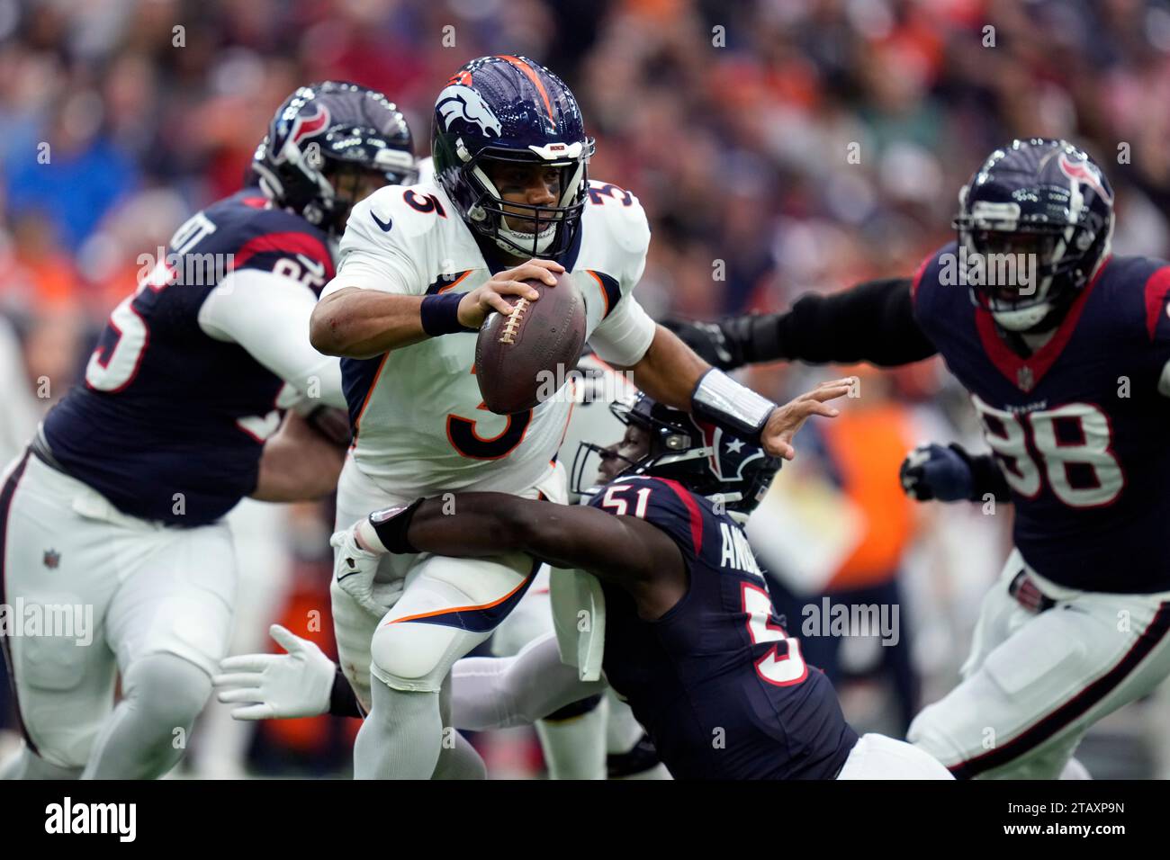 Denver Broncos quarterback Russell Wilson (3) is sacked by Houston ...