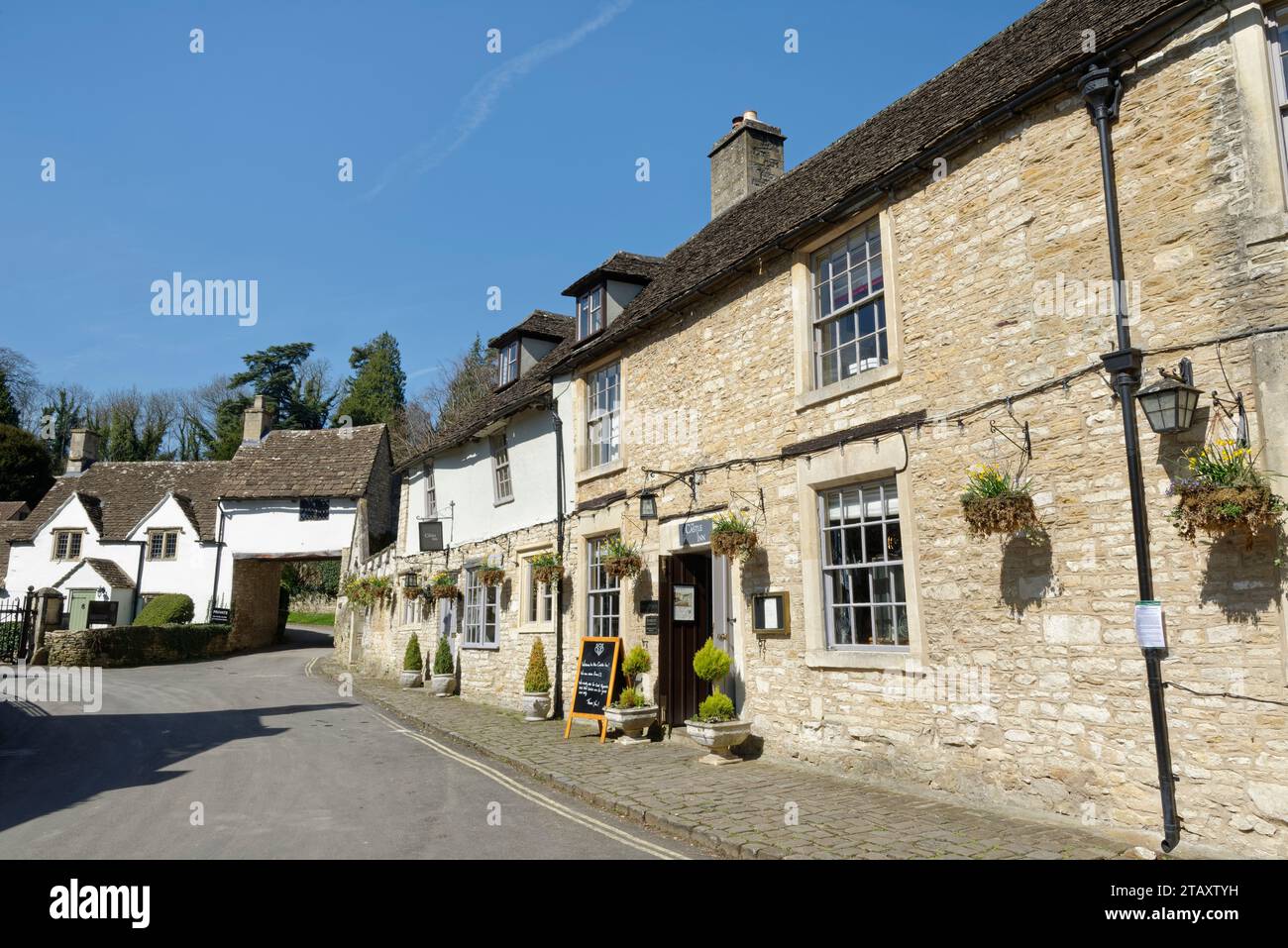 Castle Inn, Manor House and Archway Cottage, West Street, Castle Combe, Wiltshire, UK, April 2023. Stock Photo