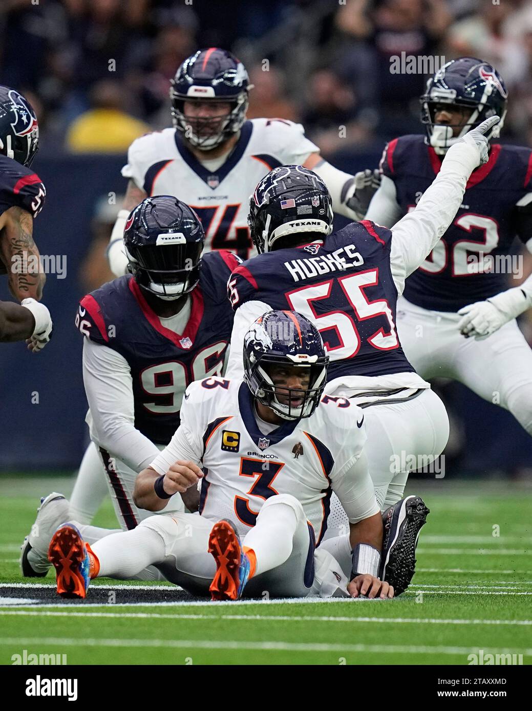 Denver Broncos quarterback Russell Wilson (3) gets up after being ...