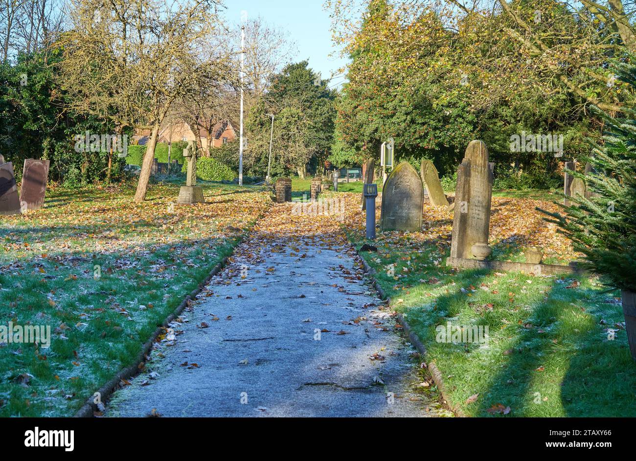 Frosty winter graveyard path in Sandiacre, Nottinghamshire, UK Stock