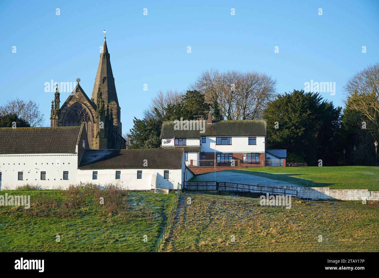 Church and farm house on a hillside in Sandiacre, Nottinghamshire, UK