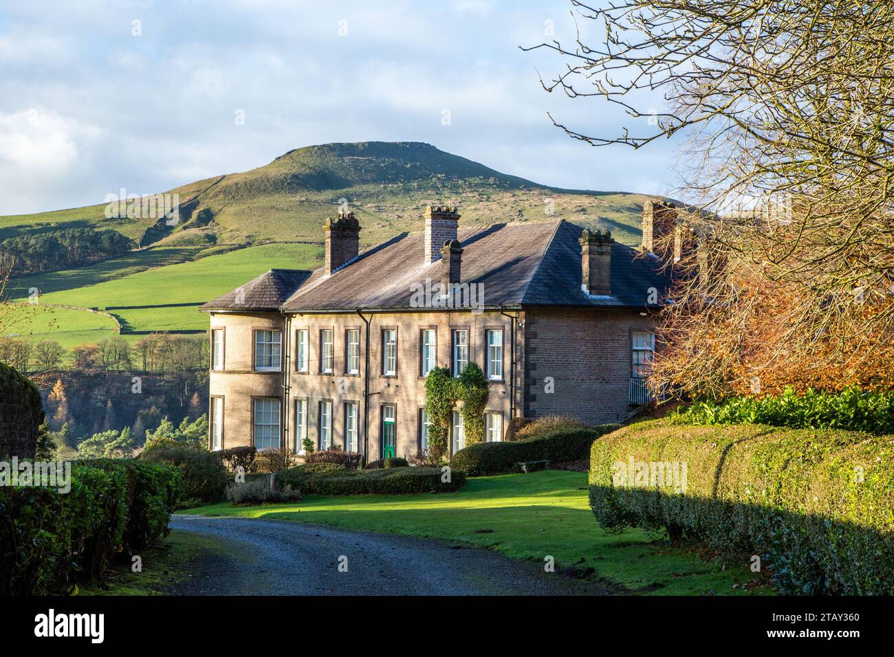 Crag Hall a country house east of the village of Wildboarclough, Cheshire, England and owned by the Earl of Derby with a view of Shutlingsloe hill Stock Photo