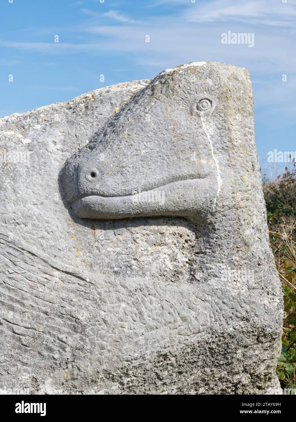 Dinosaur sculpture carved in Portland Stone at Tout Quarry Sculpture Park, Isle of Portland, Dorset, UK, October 2023. Stock Photo