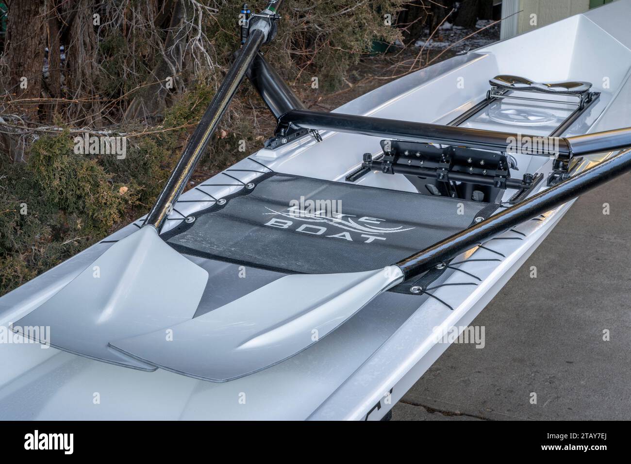 Fort Collins, CO, USA - December 2, 2023: Cockpit of a coastal rowing shell with sculling oars, Literace 1x by Litebox, in a driveway. Stock Photo