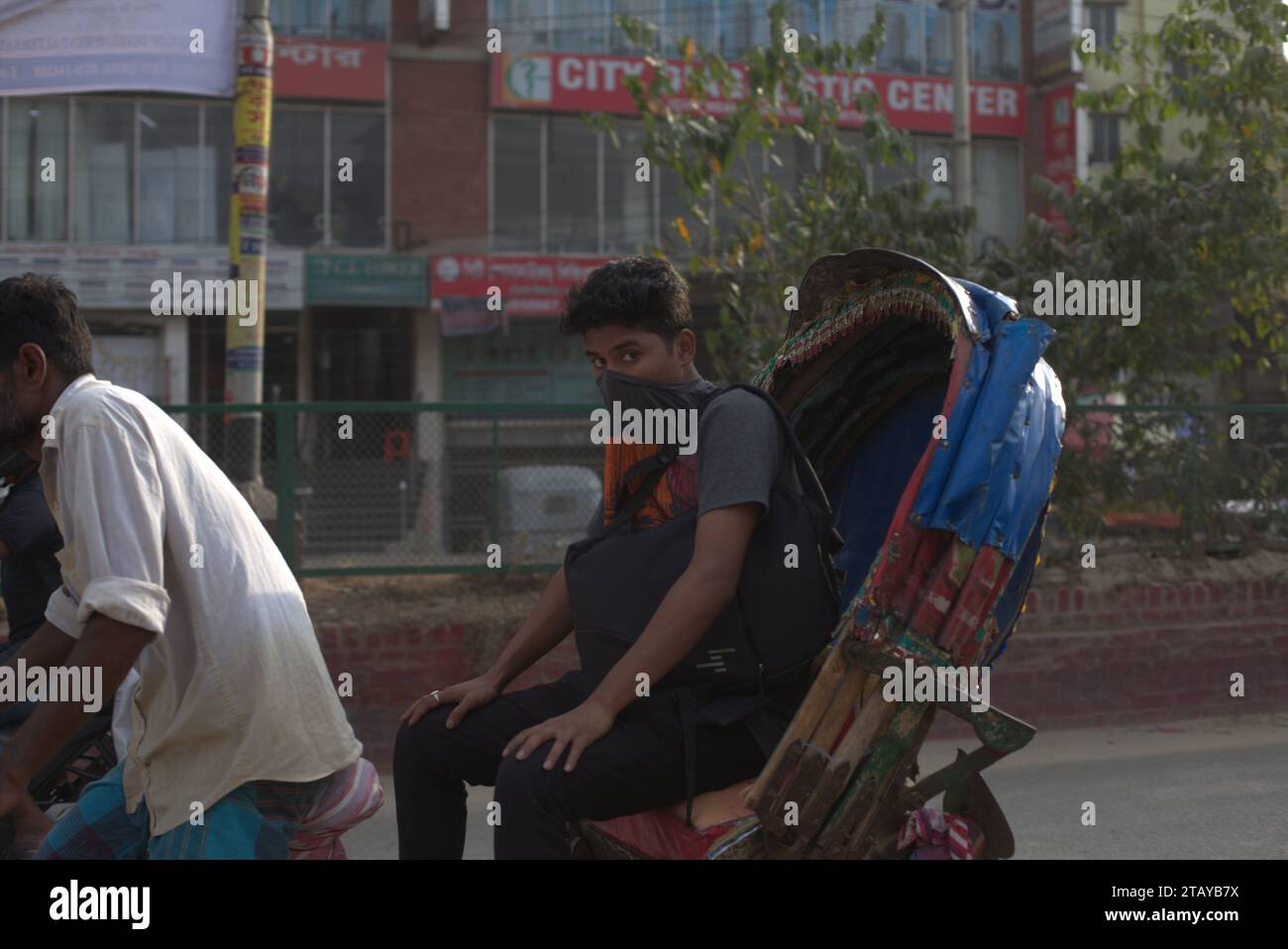 Hasan Reksha Dhaka, Bangladesh. 4th Dec, 2023. A rickshaw passenger reacts to the ...