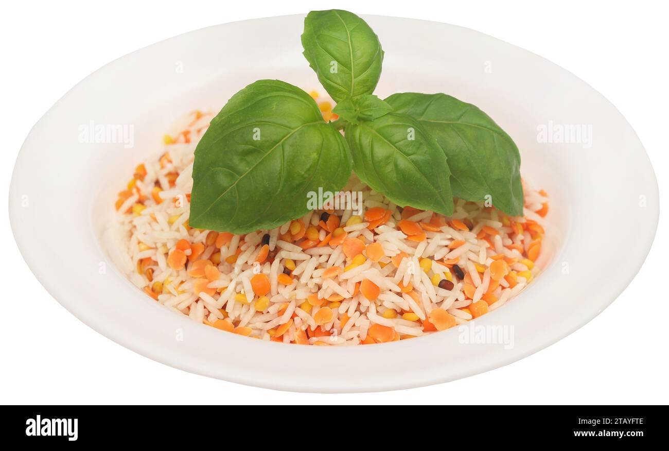 Lentil rice with fresh basil leaves in a bowl Stock Photo