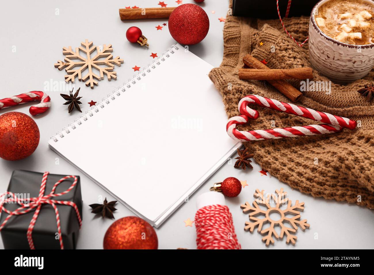 Blank paper calendar with cup of hot chocolate, gift box and Christmas ...