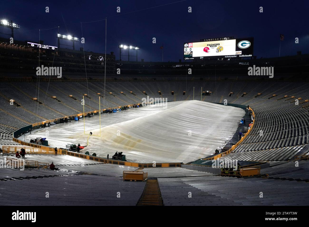 Lambeau Field is covered with a tarp with heaters before an NFL