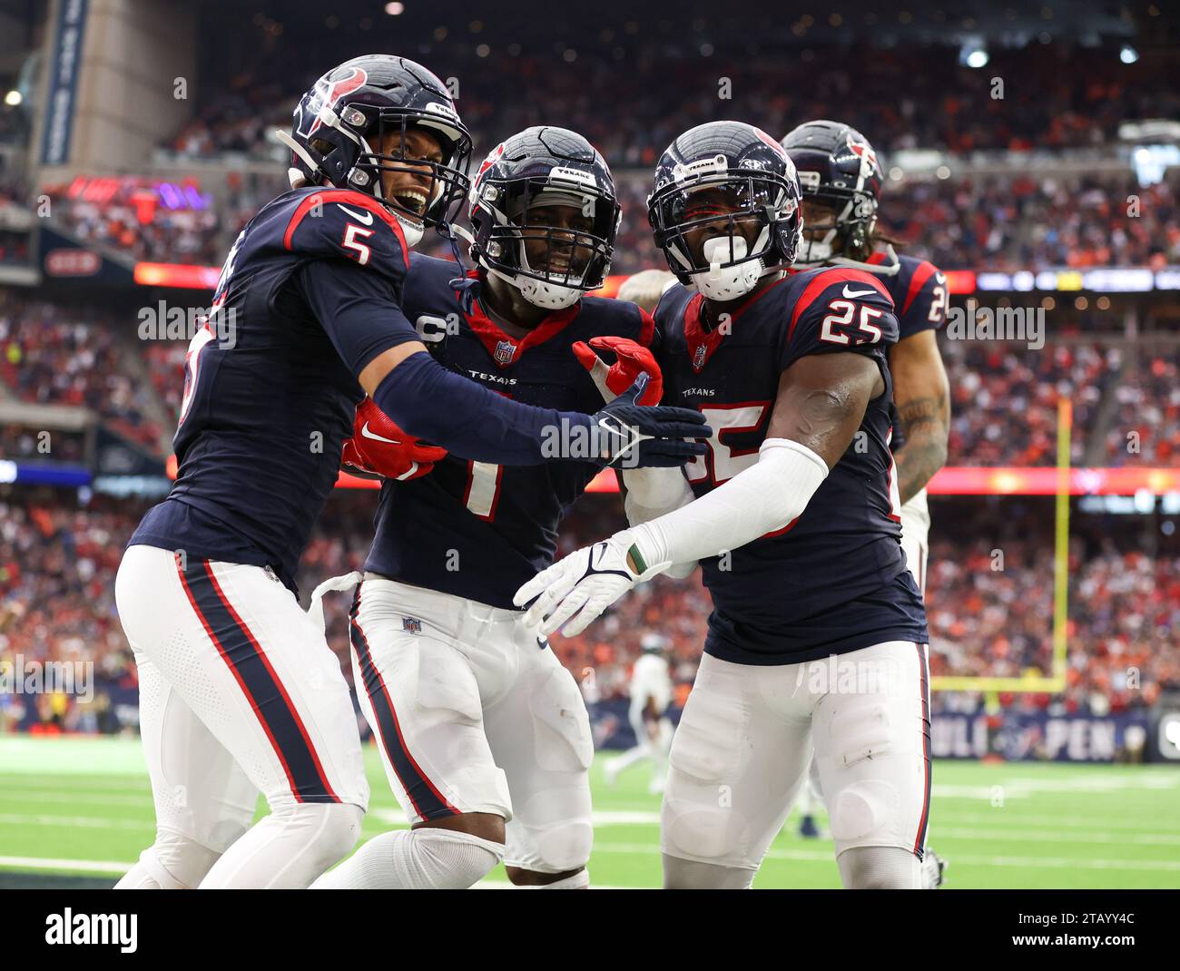 December 3, 2023: Texans safety Jalen Pitre (5) and cornerback Desmond King II (25) celebrate with safety Jimmie Ward (1) after Ward made an interception in the end zone in the final seconds of the game to secure a 22-17 win over the Broncos in an NFL game on December 3, 2023 in Houston. (Credit Image: © Scott Coleman/ZUMA Press Wire) EDITORIAL USAGE ONLY! Not for Commercial USAGE! Stock Photo