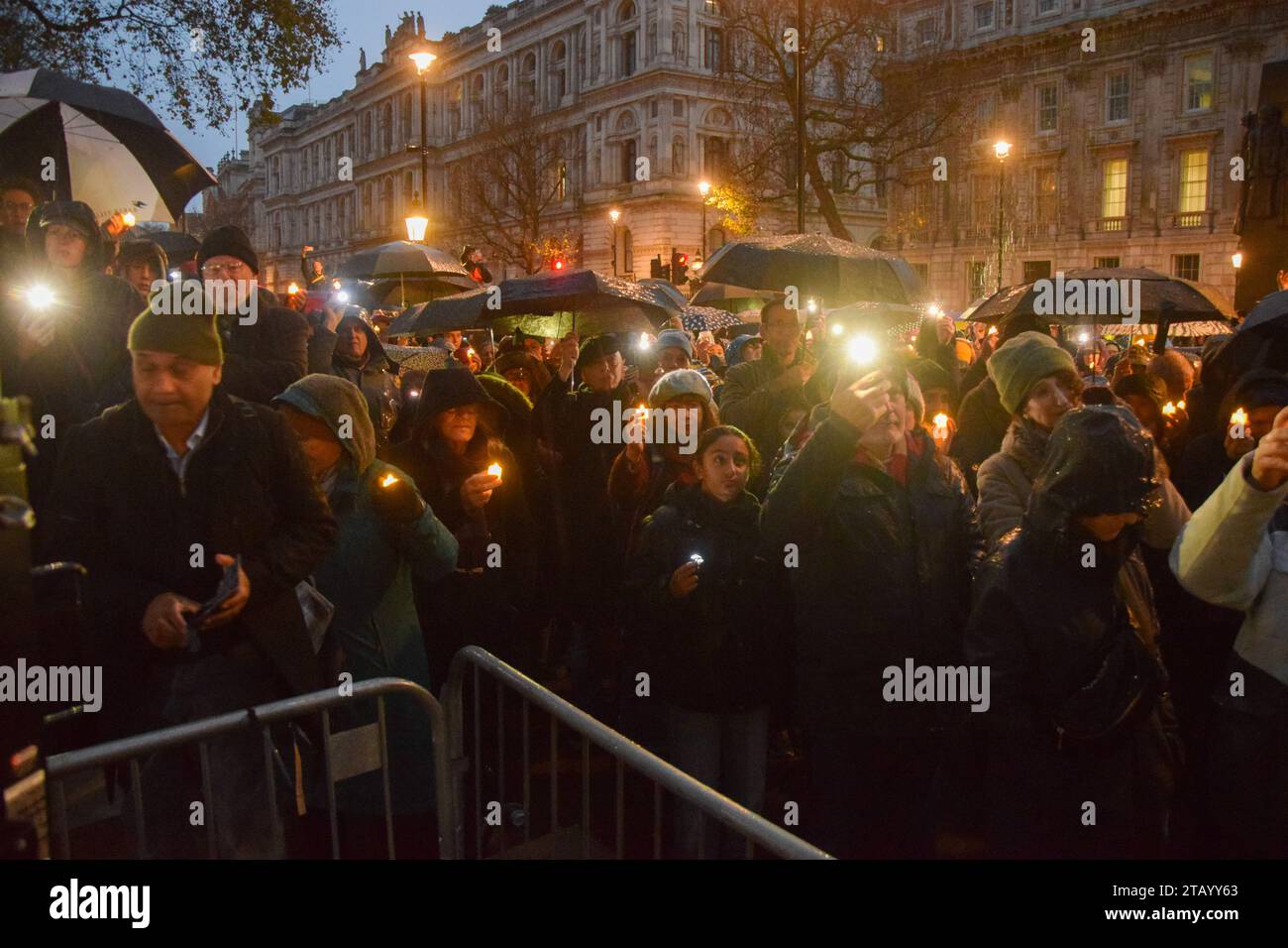 London, England, UK. 3rd Dec, 2023. People hold up lights and mobile phones at a vigil in Whitehall for lives lost on all sides during the Israel-Hamas war, and for peace. (Credit Image: © Vuk Valcic/ZUMA Press Wire) EDITORIAL USAGE ONLY! Not for Commercial USAGE! Stock Photo