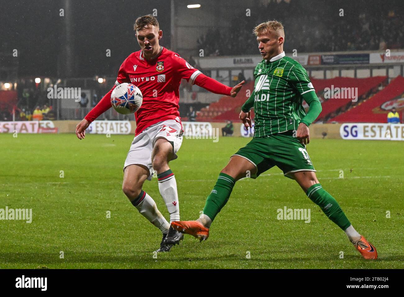 Jake Bickerstaff 27 of Wrexham and Will Dawes of Yeovil Town battle