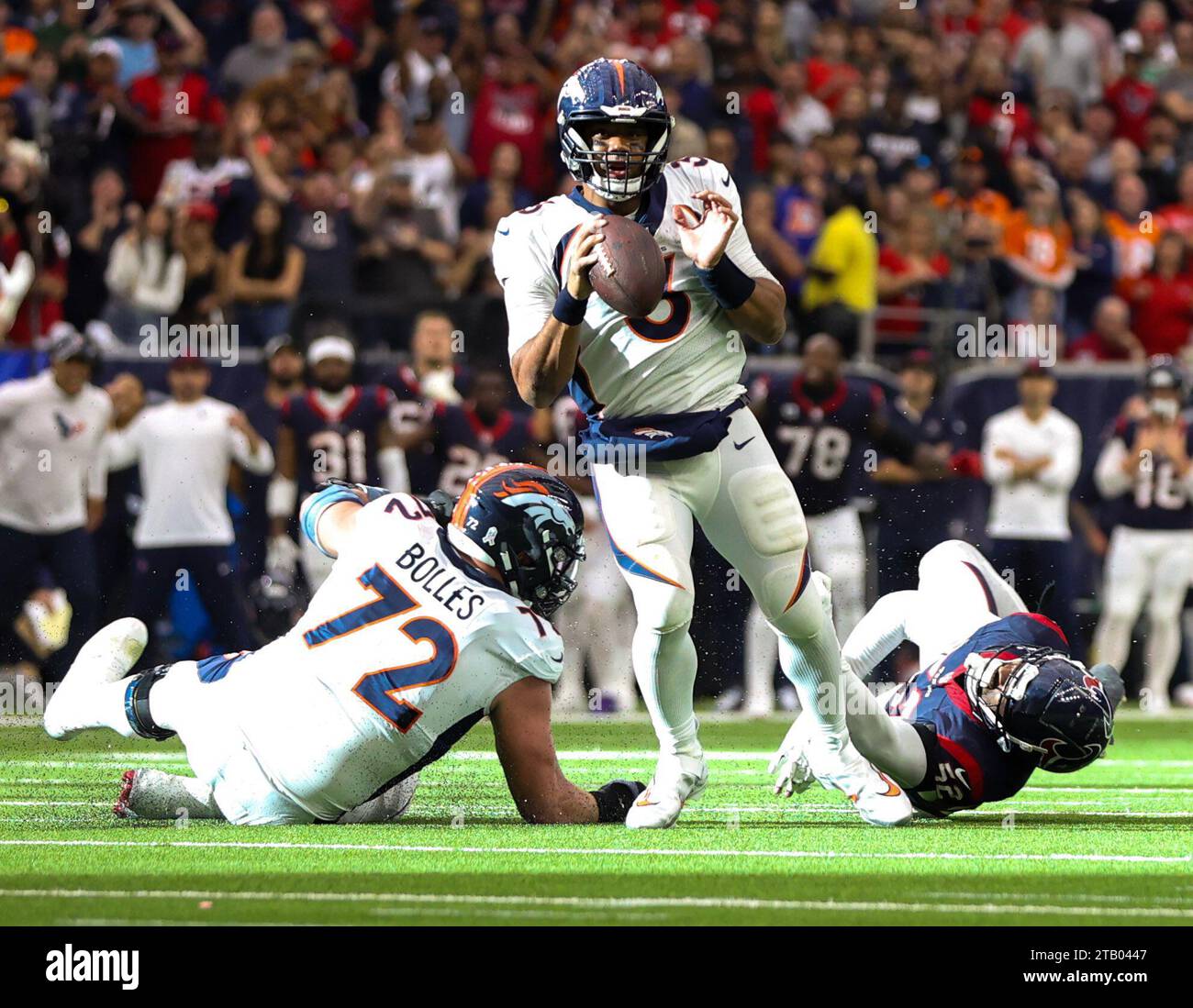 December 3, 2023: Broncos quarterback Russell Wilson (3) shakes off ...