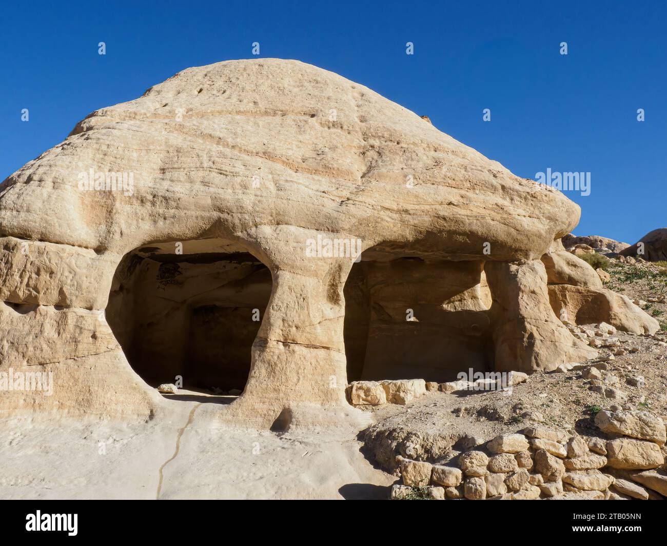 Stone carved caves  in Petra Archaeological Park, a UNESCO World Heritage Site, the New 7 Wonders of the World, Jordan. Stock Photo