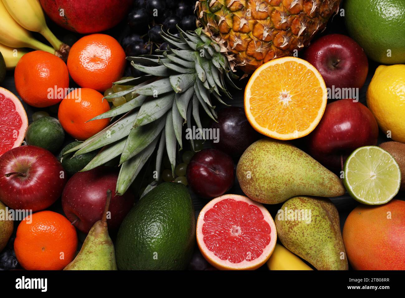 Different ripe fruits as background, top view Stock Photo - Alamy