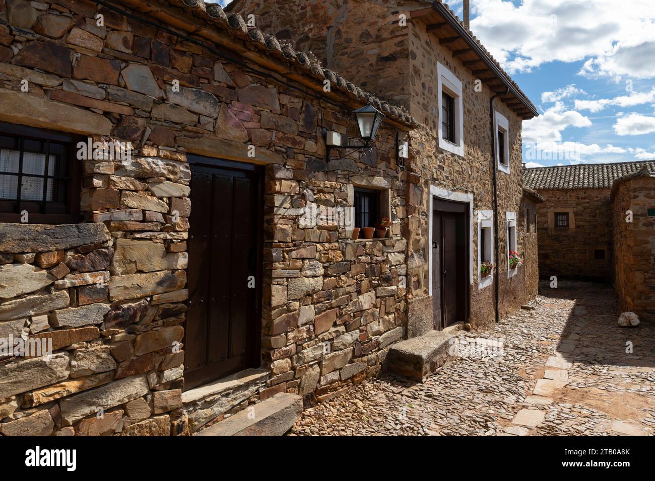 Traditional homes on Calle de las Chinchillas in the Maragato village of Castrillo de los Polvazares along the Camino Frances in Leon, Spain. This anc Stock Photo