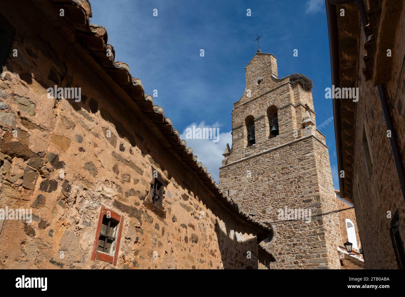 View of the bell tower of Iglesia Santa María Magdalena in the Maragato village of Castrillo de los Polvazares along the Camino Frances in Leon, Spain Stock Photo