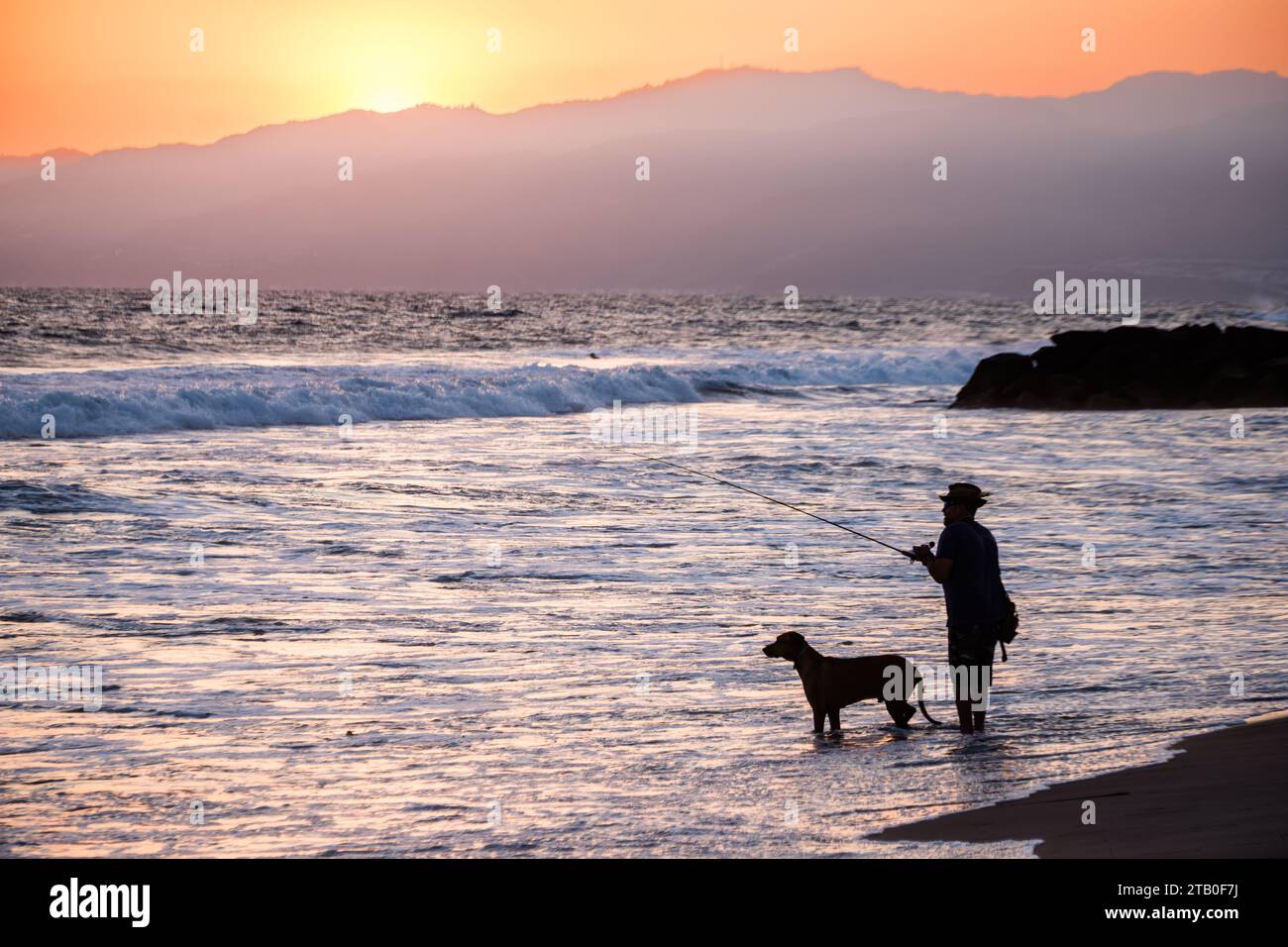 Silhouettes on the beach at sunset in Venice Beach, California, USA, Pacific Coast. Stock Photo