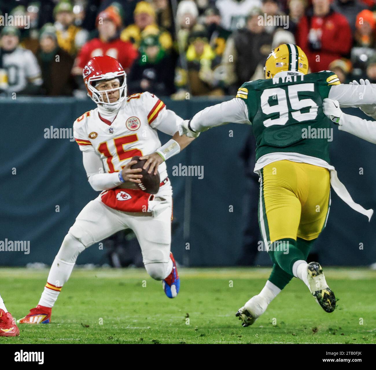 Green Bay, United States. 03rd Dec, 2023. Kansas City Chiefs quarterback Patrick Mahomes (L) moves away from Green Bay Packers defensive tackle Devonte Wyatt (R) during the the NFL game between the Kansas City Chiefs and the Green Bay Packers at Lambeau Field on Sunday, December 03, 2023. Photo by Tannen Maury/UPI Credit: UPI/Alamy Live News Stock Photo