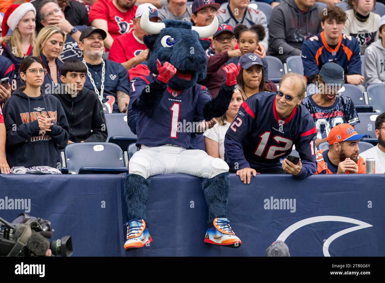 Houston, TX, USA. 3rd Dec, 2023. Houston Texans mascot Toro sits with fans during a game between the Denver Broncos and the Houston Texans in Houston, TX. Trask Smith/CSM (Credit Image: © Trask Smith/Cal Sport Media). Credit: csm/Alamy Live News Stock Photo