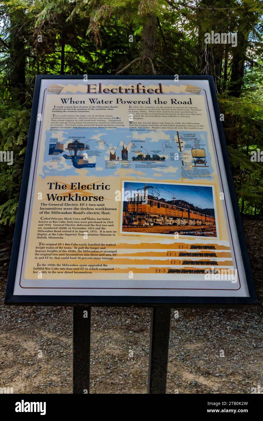Interpretive sign about electric locomotives along Milwaukee Road, now the route of the Hiawatha Scenic Bike Trail, Montana and Idaho, USA [No release Stock Photo