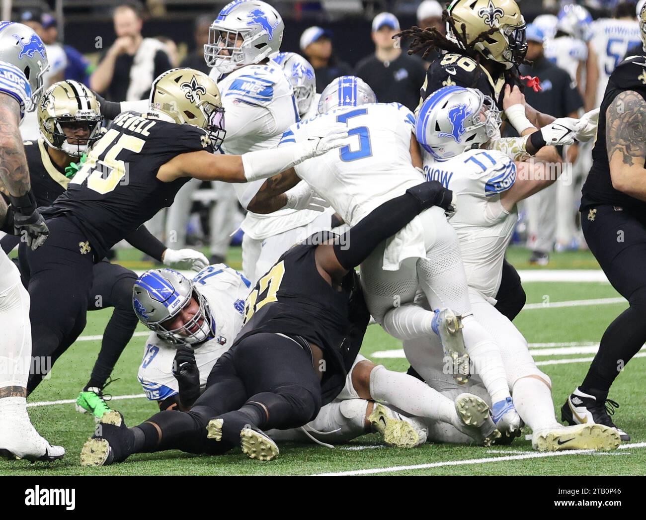 New Orleans, USA. 03rd Dec, 2023. New Orleans Saints defensive end Malcolm Roach (97) wraps up Detroit Lions running back David Montgomery (5) during a National Football League game at Caesars Superdome in New Orleans, Louisiana on Sunday, December 3, 2023. (Photo by Peter G. Forest/Sipa USA) Credit: Sipa USA/Alamy Live News Stock Photo