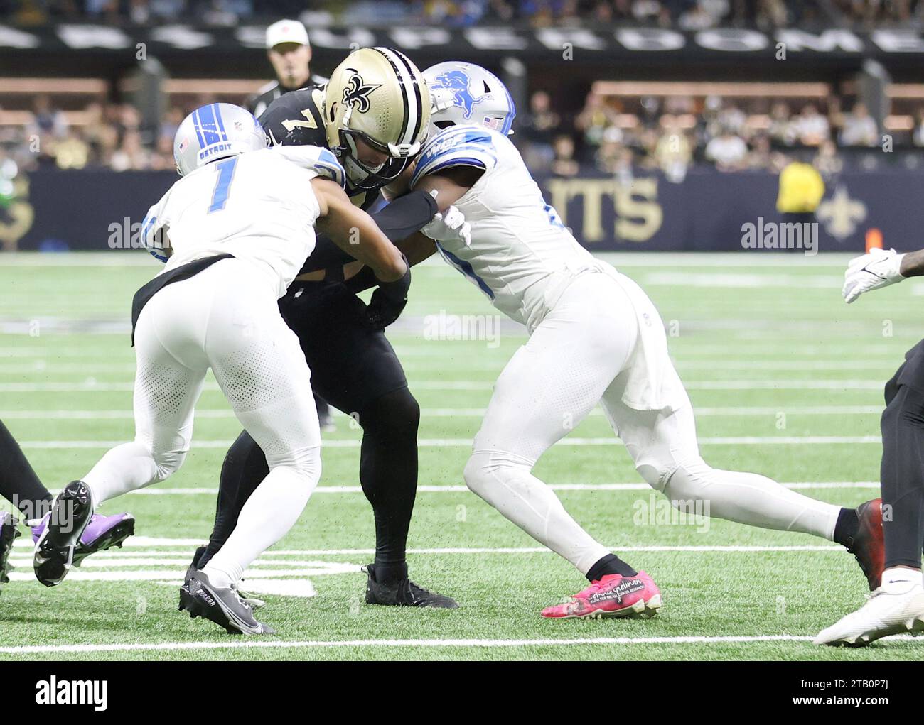 New Orleans, USA. 03rd Dec, 2023. Detroit Lions cornerback Cameron Sutton (1) and safety Tracy Walker III (21) both try to take down New Orleans Saints quarterback Taysom Hill (7) during a National Football League game at Caesars Superdome in New Orleans, Louisiana on Sunday, December 3, 2023. (Photo by Peter G. Forest/Sipa USA) Credit: Sipa USA/Alamy Live News Stock Photo