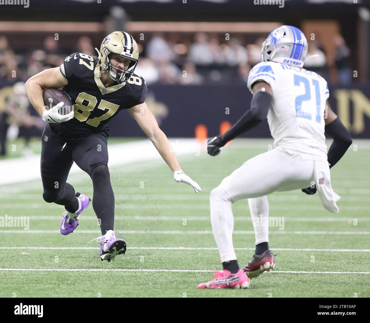 New Orleans, USA. 03rd Dec, 2023. New Orleans Saints tight end Foster Moreau (87) tries to run past Detroit Lions safety Tracy Walker III (21) during a National Football League game at Caesars Superdome in New Orleans, Louisiana on Sunday, December 3, 2023. (Photo by Peter G. Forest/Sipa USA) Credit: Sipa USA/Alamy Live News Stock Photo