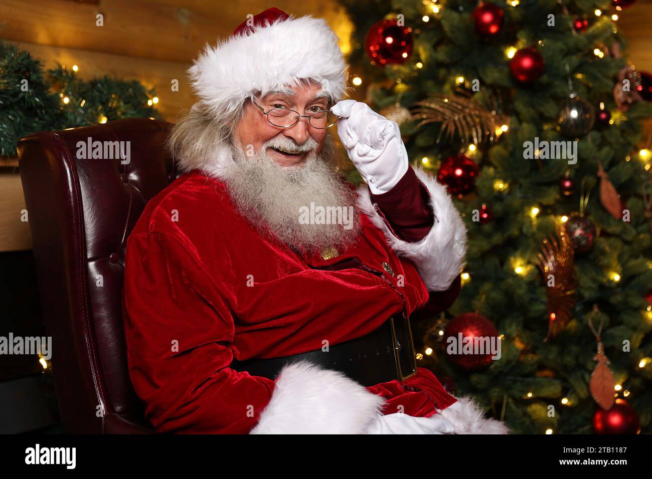 EDITORIAL USE ONLY Father Christmas receives an at home eye test as Specsavers celebrates 10 years of domiciliary care. Issue date: Monday December 4, 2023. Stock Photo