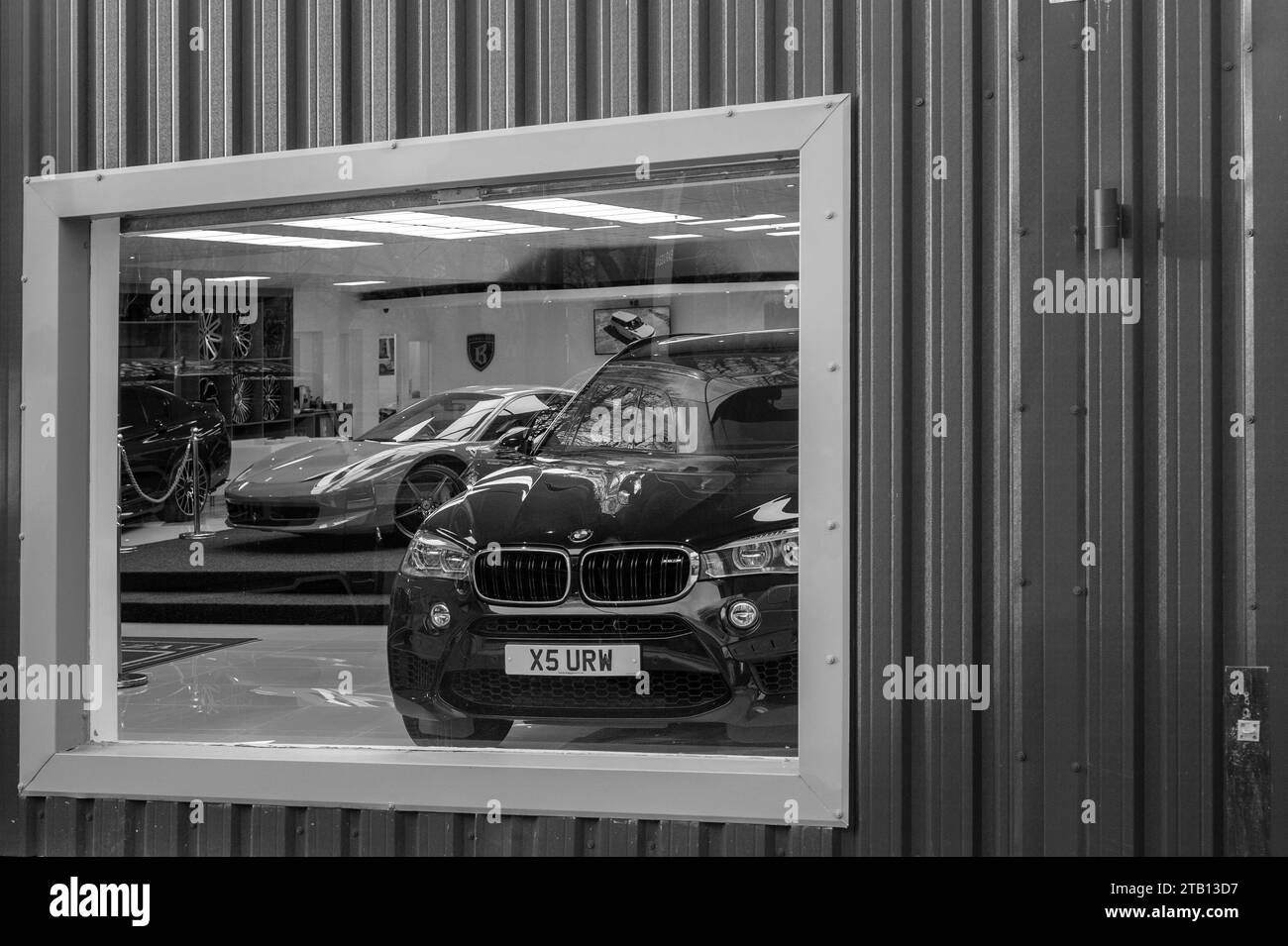 Luxury cars through showroom window,Warwick Street, Sandyford, Newcastle upon Tyne Stock Photo